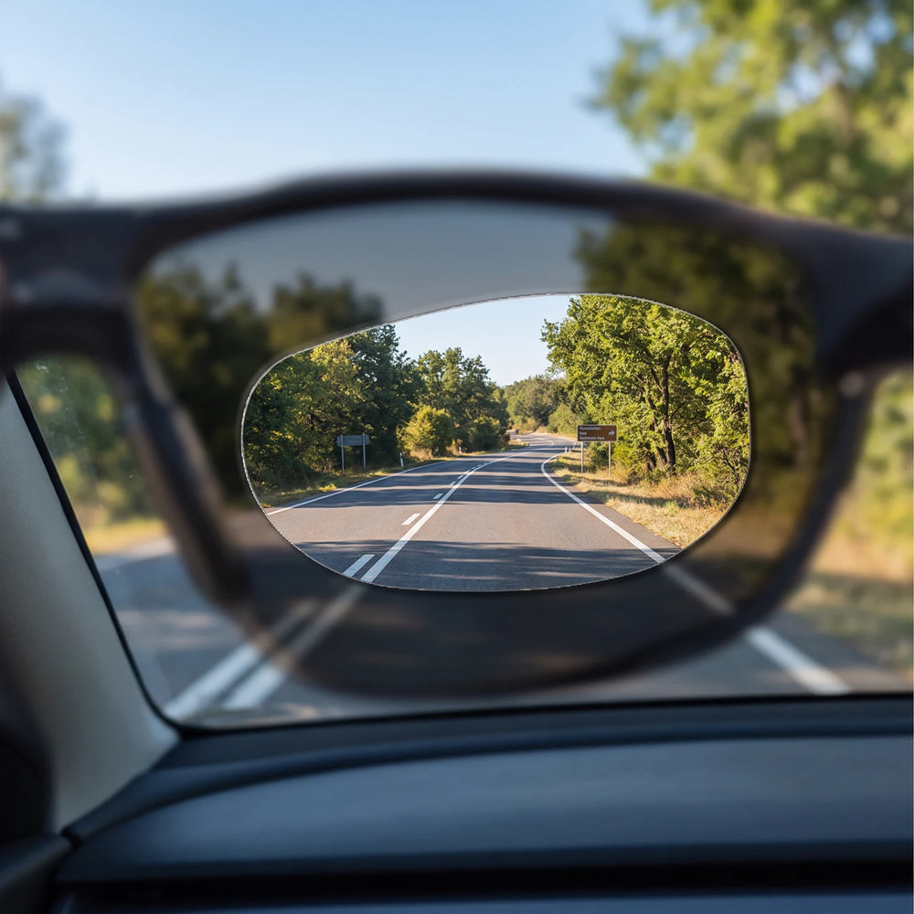 Illustrative view through sunglasses showing a clearer area within the oval insert.